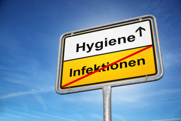 Bild eines Ortsausgangsschildes: "Infektionen" sind durchgestrichen, nächster Ort "Hygiene"